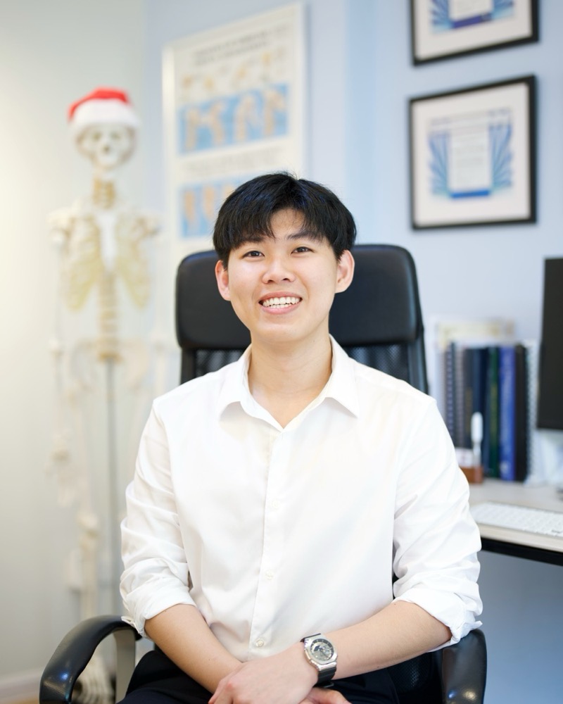 Portrait of Dr Jason Wong in his consultation room at Aligned